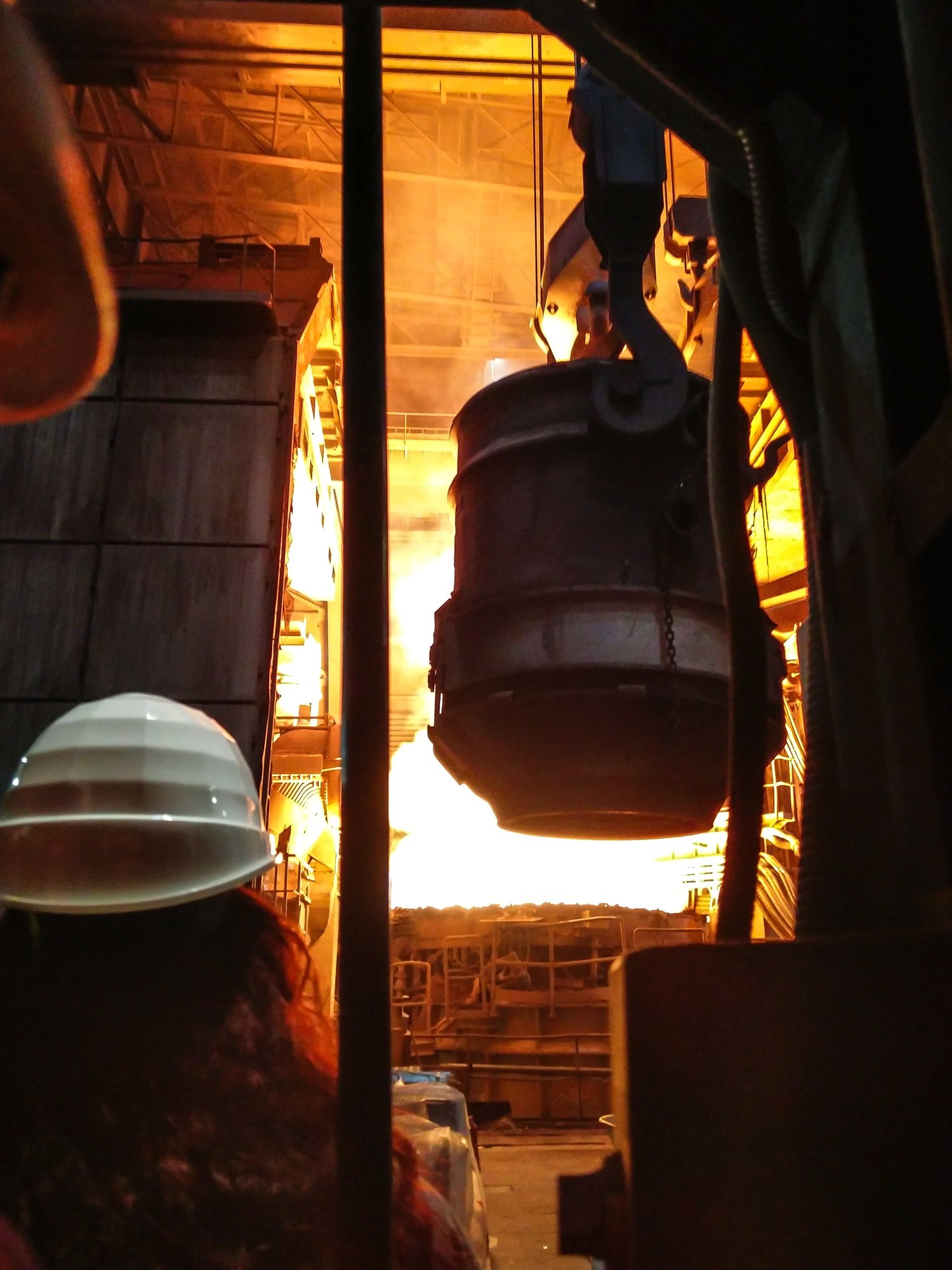 Smelting of metal in big foundry. Iron and steel production at a metallurgical plant. Steel worker